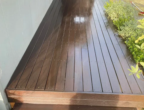 Completed deck painting with a clean finish and refreshed outdoor appearance